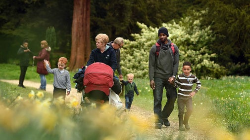 Visitors in the garden in spring at Belton House, Lincolnshire